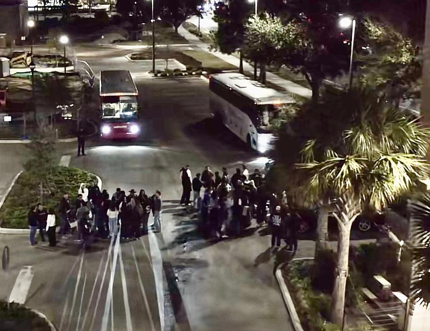 Riders boarding the party bus at night